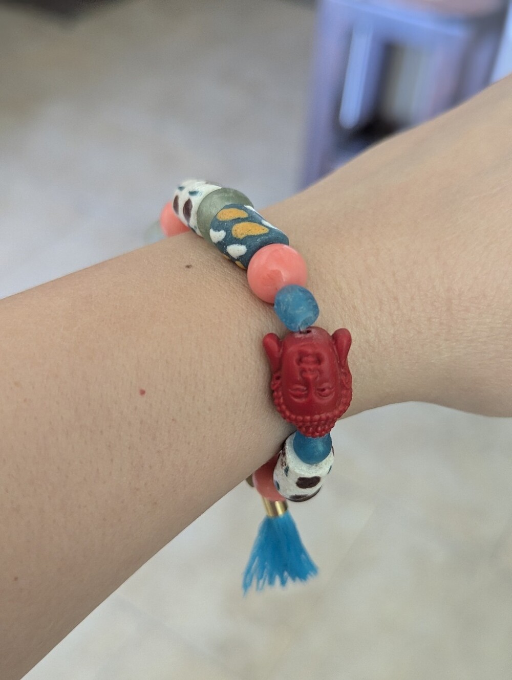 Colorful Beaded Bracelet with Red Buddha Charm
